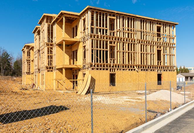 a snapshot of temporary chain link fences protecting a large construction project from unauthorized access in Malverne NY